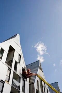 Cherry picker and incomplete building exterior Stock Photos