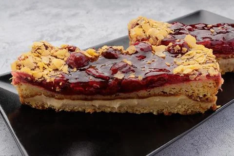 Cherry pie close-up on a black plate Stock Photos