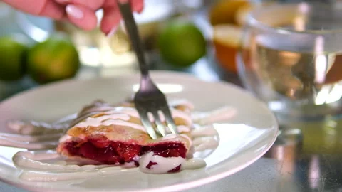 Cherry pie fork poke slice open lots of filling cherry strudel with sour cream Stock Footage 301432796