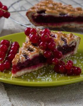 Cherry pie on green plate Stock Photos