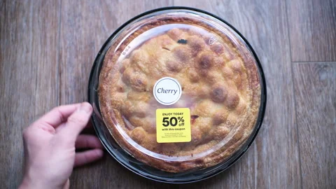 Cherry pie in plastic container on sale in bakery store sweet dessert food Stock Footage 330295469
