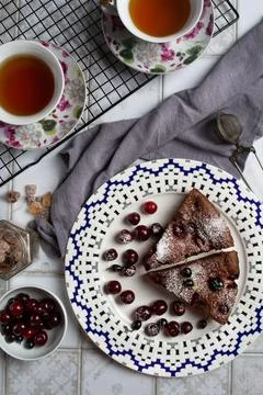 Cherry pie on a white plate on the kitchen table Foto stock