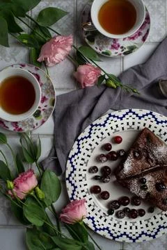 Cherry pie on a white plate on the kitchen table Stock Photos