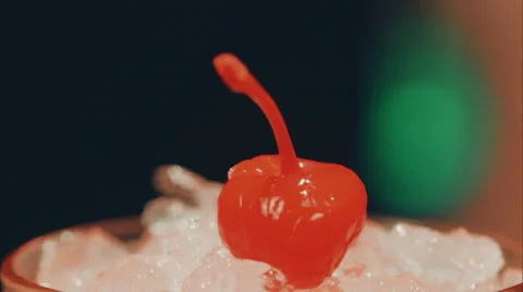 Cherry is placed in a glass with ice Stock Footage 52183463