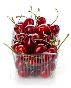 Cherry in plastic container box isolated on white Stock Photos