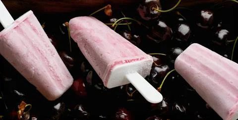 Cherry popsicles on white background Stock Photos