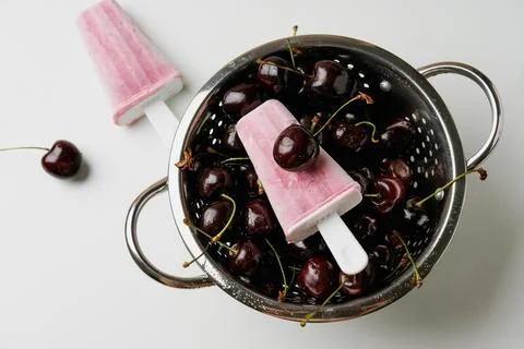 Cherry popsicles on white background Stock Photos