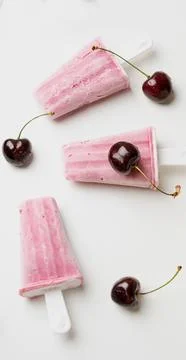 Cherry popsicles on white background Stock Photos