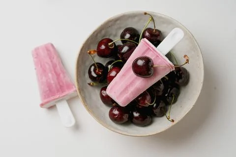 Cherry popsicles on white background Stock Photos