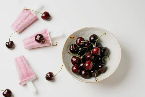 Cherry popsicles on white background Stock Photos