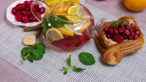 Cherry raspberry tea with orange lemon and meat delicious cherry cakes Stock Footage 295953708