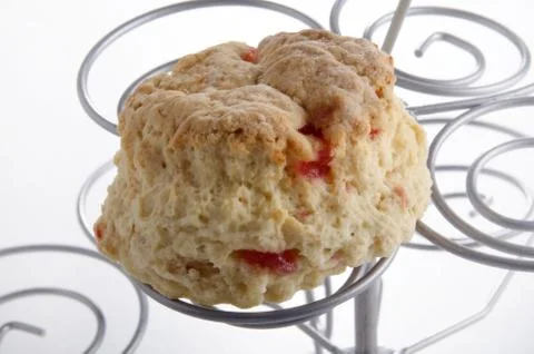 Cherry scone on a cake stand Stock Photos
