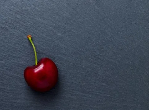 Cherry on slate Stock Photos