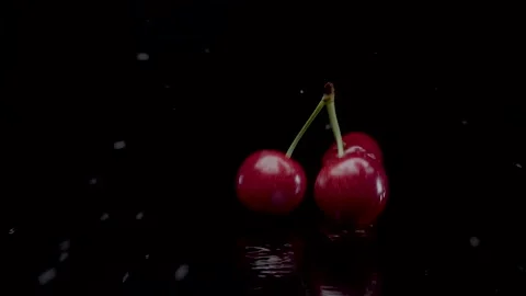Cherry slow motion closeup falling in water with Splash droplets Stock Footage 134179406