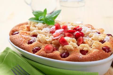 Cherry sponge cake in ceramic casserole dish Stock Photos