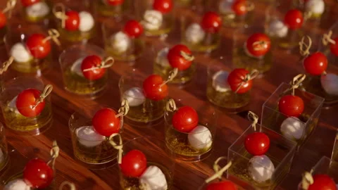 Cherry tomato and mozzarella canapes arranged for outdoor catering Видео 342768416
