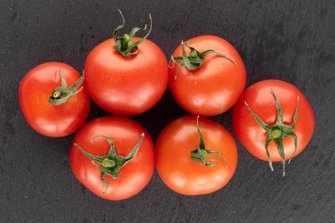 Cherry tomato on grey stone Stock Photos