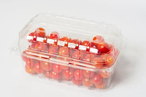 Cherry tomato in plastic container package, studio shoot on white Stock Photos