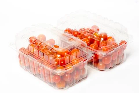 Cherry tomato in plastic container package, studio shoot on white Stock Photos
