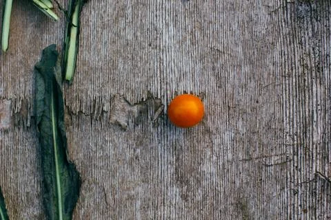 Cherry tomato on a rustic wooden table. Stock Photos