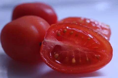 Cherry tomato in a section Stock Photos