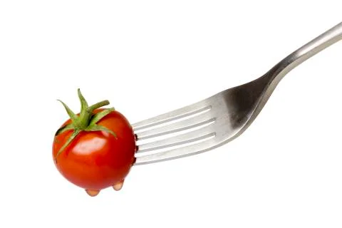 Cherry tomato spiked by a fork , isolated on white Stock Photos