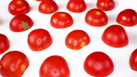 Cherry tomato tomatoes as texture pattern on rotating plate food hd video Stock Footage 98392384