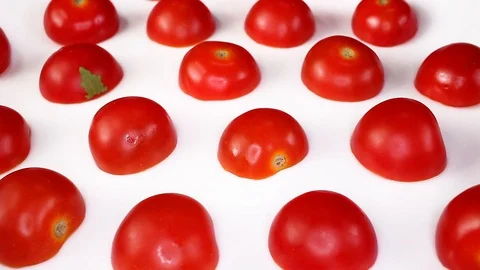 Cherry tomato tomatoes as texture pattern on rotating plate food hd video Stock Footage 98392662
