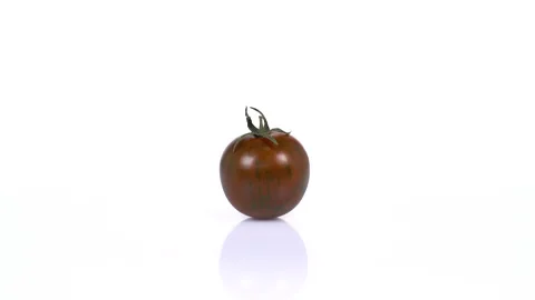 Cherry tomato turning on white background. 4k Video Stock Footage 171635094