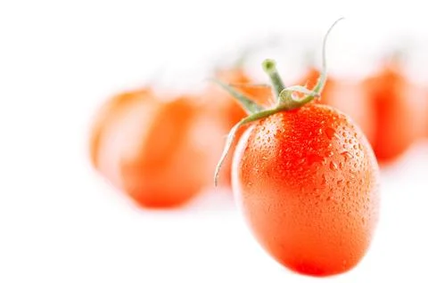 Cherry tomato  on white backdrop with tomatoes on background, sh Stock Photos