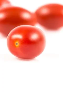 Cherry tomato on white Stock Photos