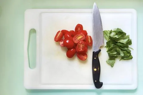 Cherry tomatoes and basil Stock Photos