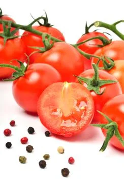 Cherry tomatoes and pepper Stock Photos