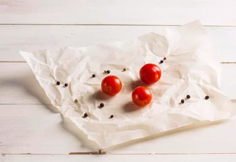 Cherry tomatoes and pepper on white background Stock Photos