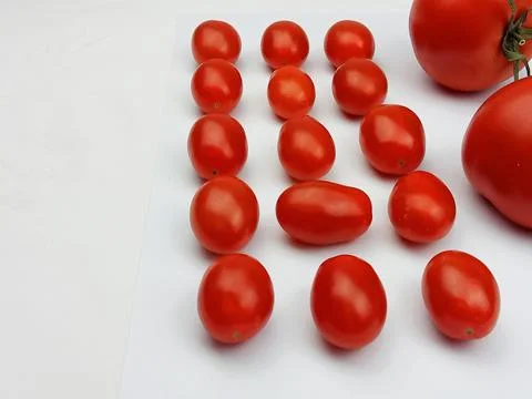 Cherry tomatoes arranged on white background Stock Photos