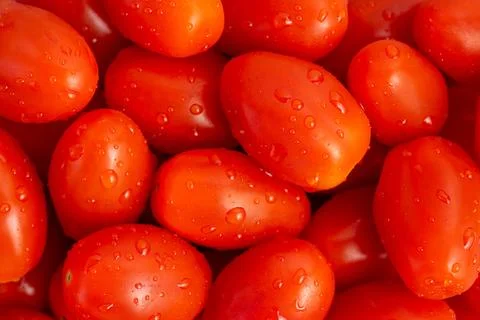 Cherry tomatoes background. Top view Stock Photos