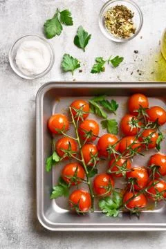 Cherry tomatoes in baking tray Stock Photos