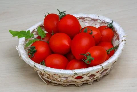 Cherry tomatoes in the basket Stock Photos