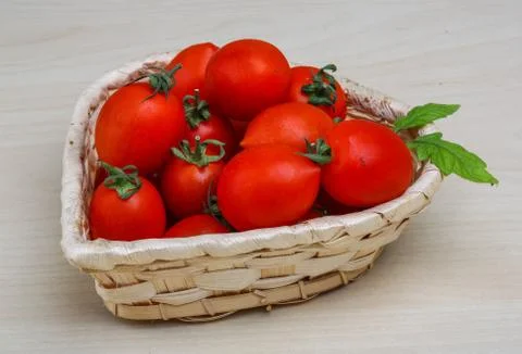 Cherry tomatoes in the basket Stock Photos