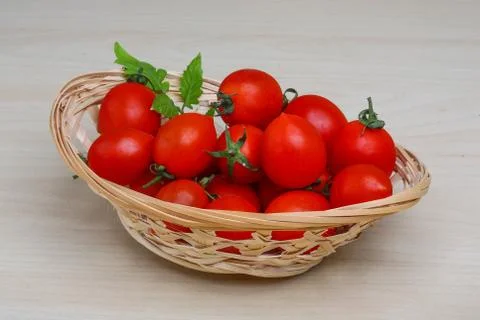 Cherry tomatoes in the basket Stock Photos
