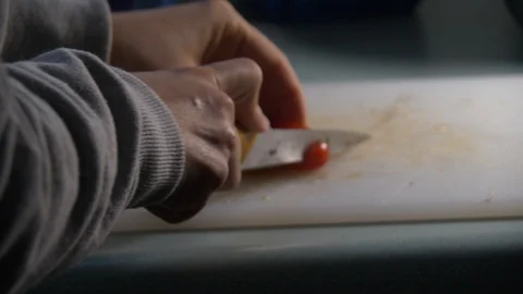 Cherry Tomatoes being sliced in slow motion. Stock-Footage 128688478