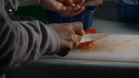 Cherry Tomatoes being sliced in slow motion. Stock Footage 128688605