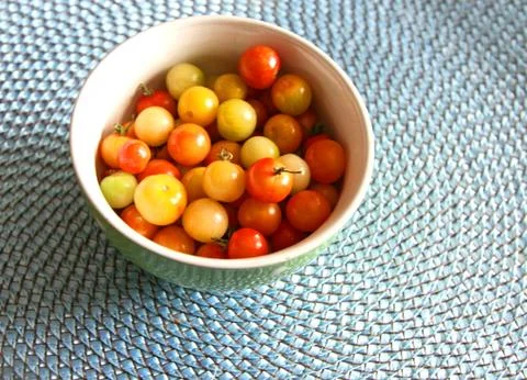 Cherry tomatoes in bowl Stock Photos