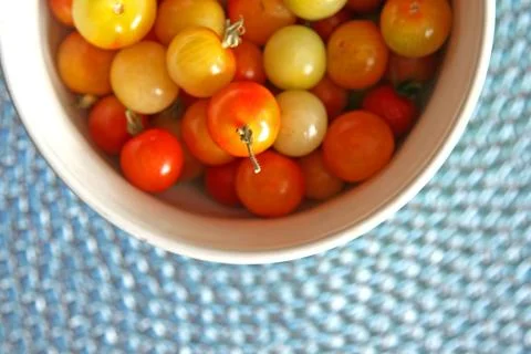 Cherry tomatoes in bowl Stock Photos