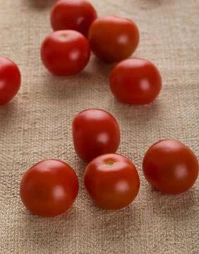 Cherry tomatoes on cloth Stock Photos