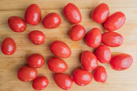 Cherry tomatoes on a cutting board Stock Photos
