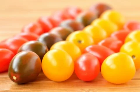 Cherry tomatoes of different colors Stock Photos