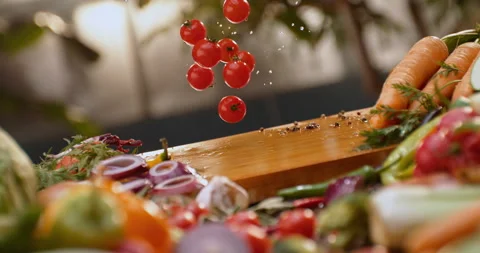 Cherry tomatoes dropping on a wood Vídeos de archivo 311832898