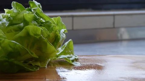 Cherry tomatoes fall on a cutting board Stock-Footage 68995984