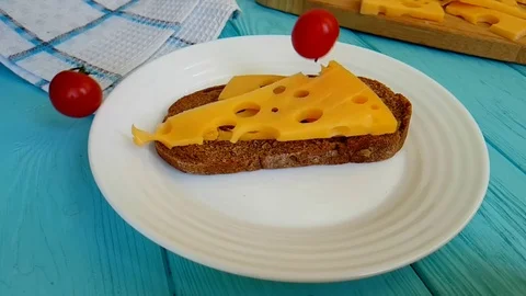 Cherry tomatoes fall sandwich with cheese slow-motion shot Stock Footage 89712940